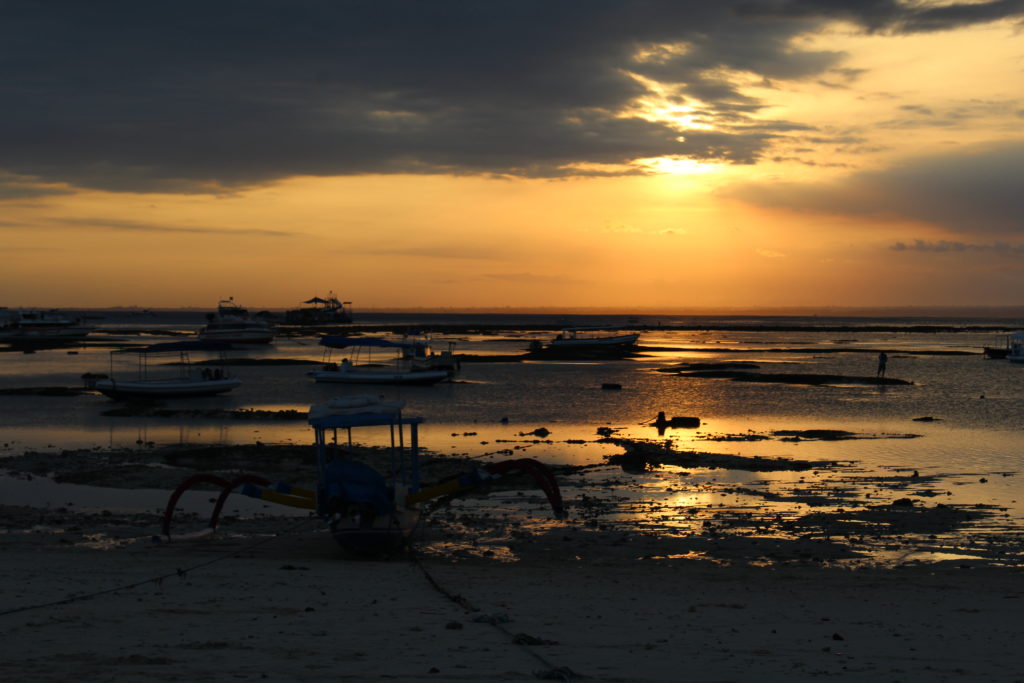 sunset at the beach in nusa lembongan, indonesia
