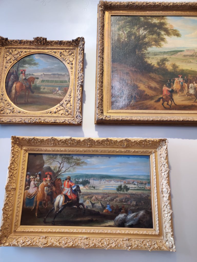 paintings at the palace of versailles in Paris, France