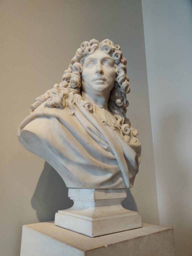 a statue of Louis XIV at the palace of versailles in Paris, France