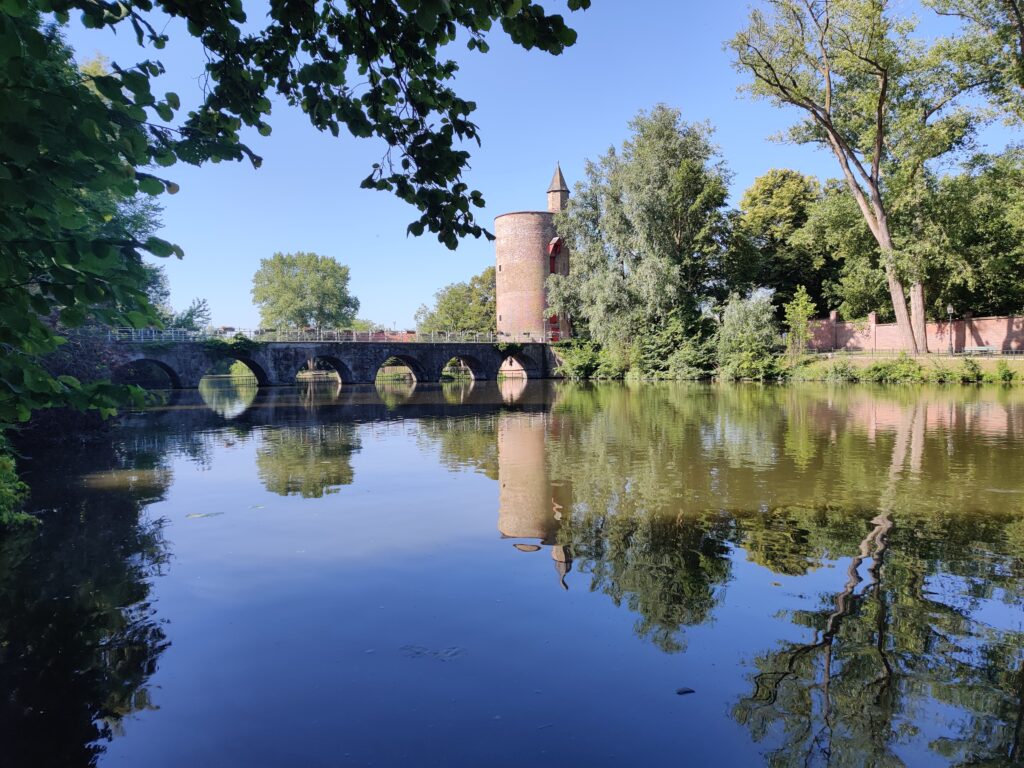 Minnewater lake, bridge, and park in bruges, belgium